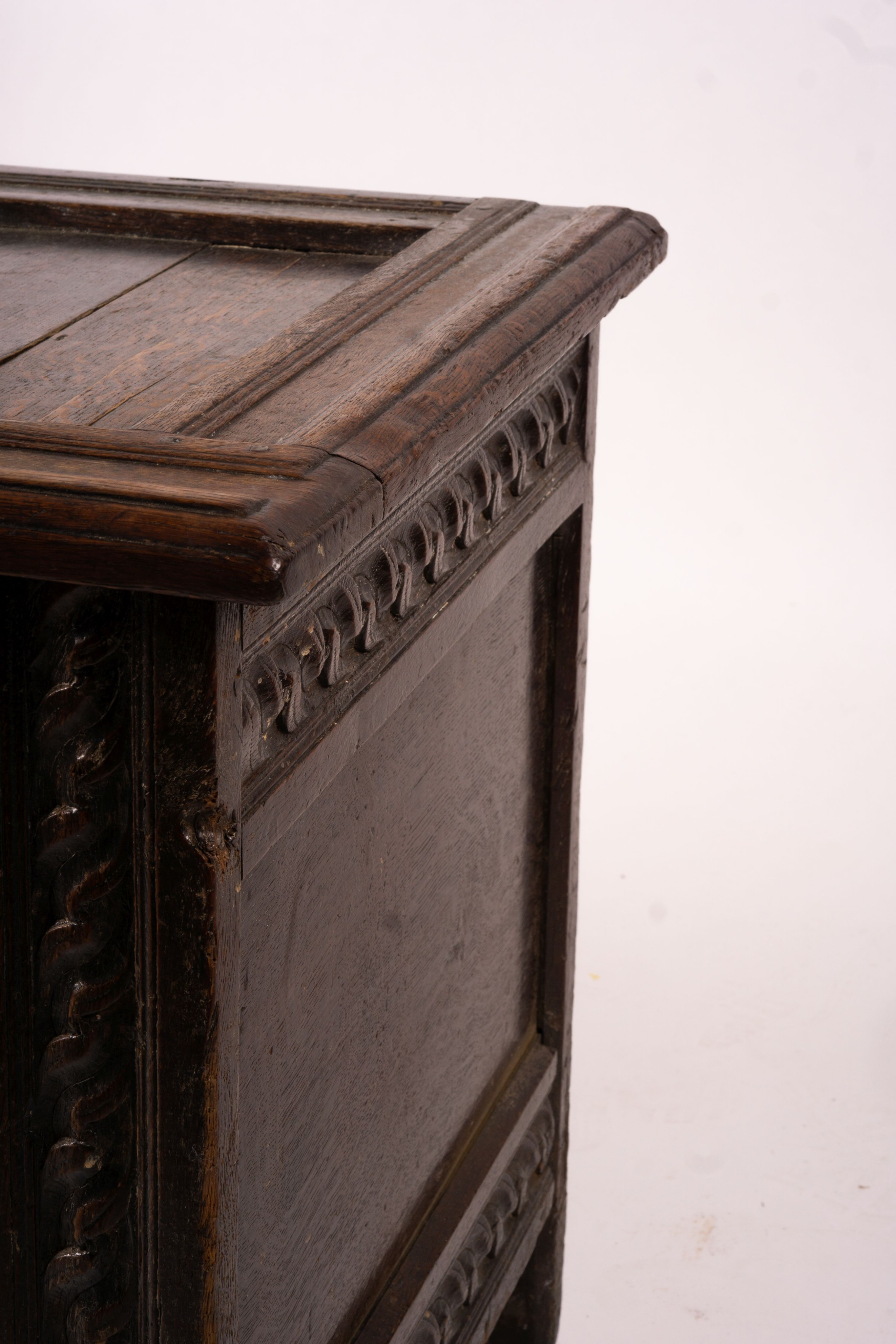 A 17th century carved panelled oak coffer, length 115cm, depth 56cm, height 67cm